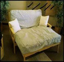 Lounger is a full size bed turned the other way to take up less wall space!